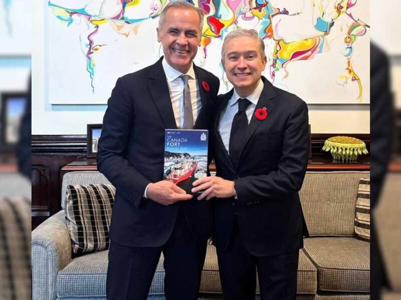 Prime Minister Mark Carney alongside finance minister François-Philippe Champagne holding the 2025 federal budget.