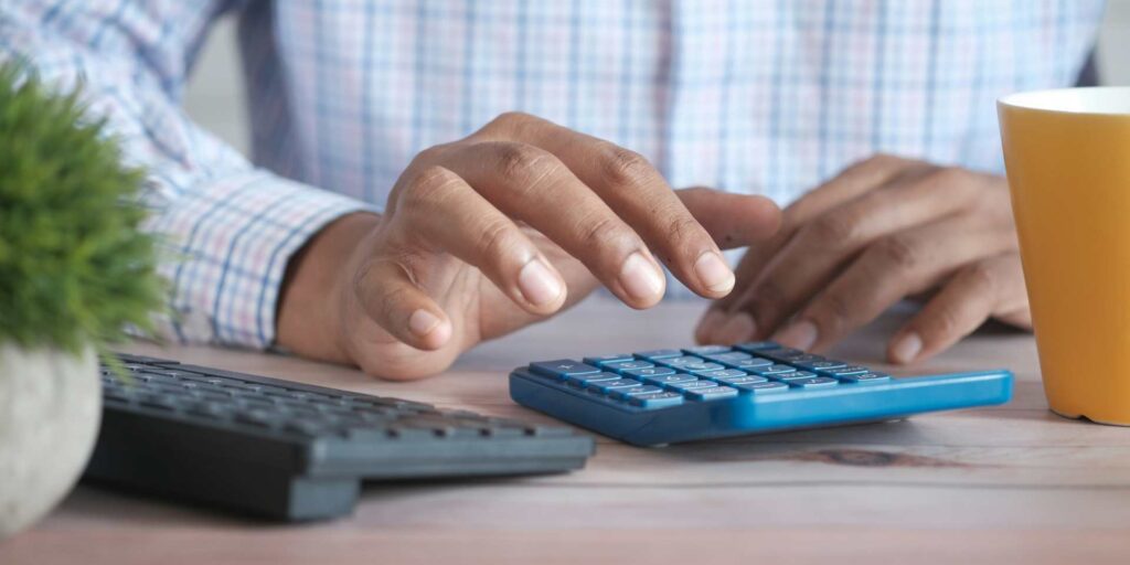 A person using a calculator.