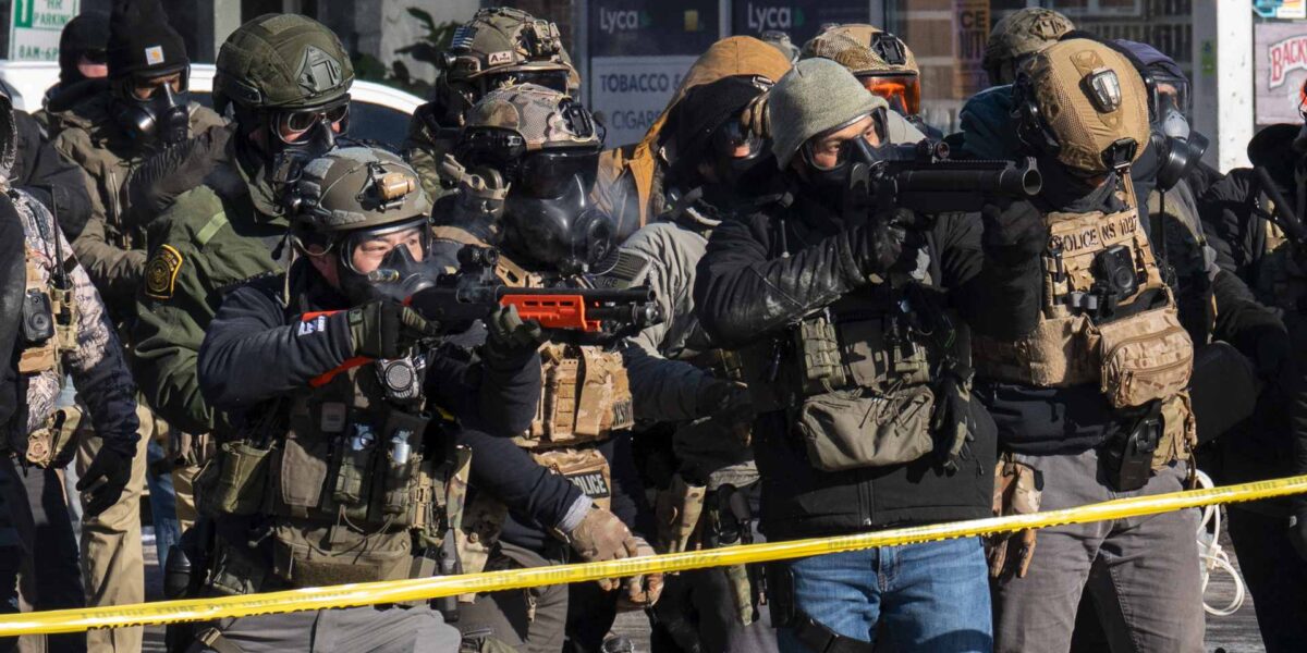 ICE officers pointing weapons at civilians in Minnesota after the shooting of Alex Pretti.