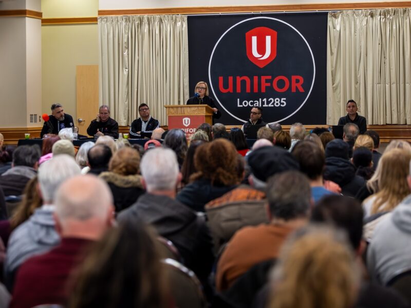 An image of Lana Payne, president of Unifor, addressing the crowd at a meeting of Unifor Local 1285. The Stellantis Brampton assembly plant that employs many of this local's members just secured protection through auto assembly zoning.