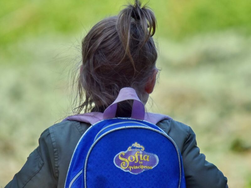 A child wearing a backpack.