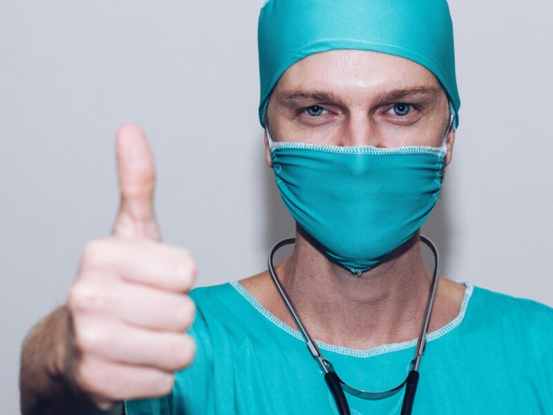 An image of a nurse in scrubs doing a thumbs up towards the camera. Nurses' unions are applauding the new Connected Care for Canadians Act.