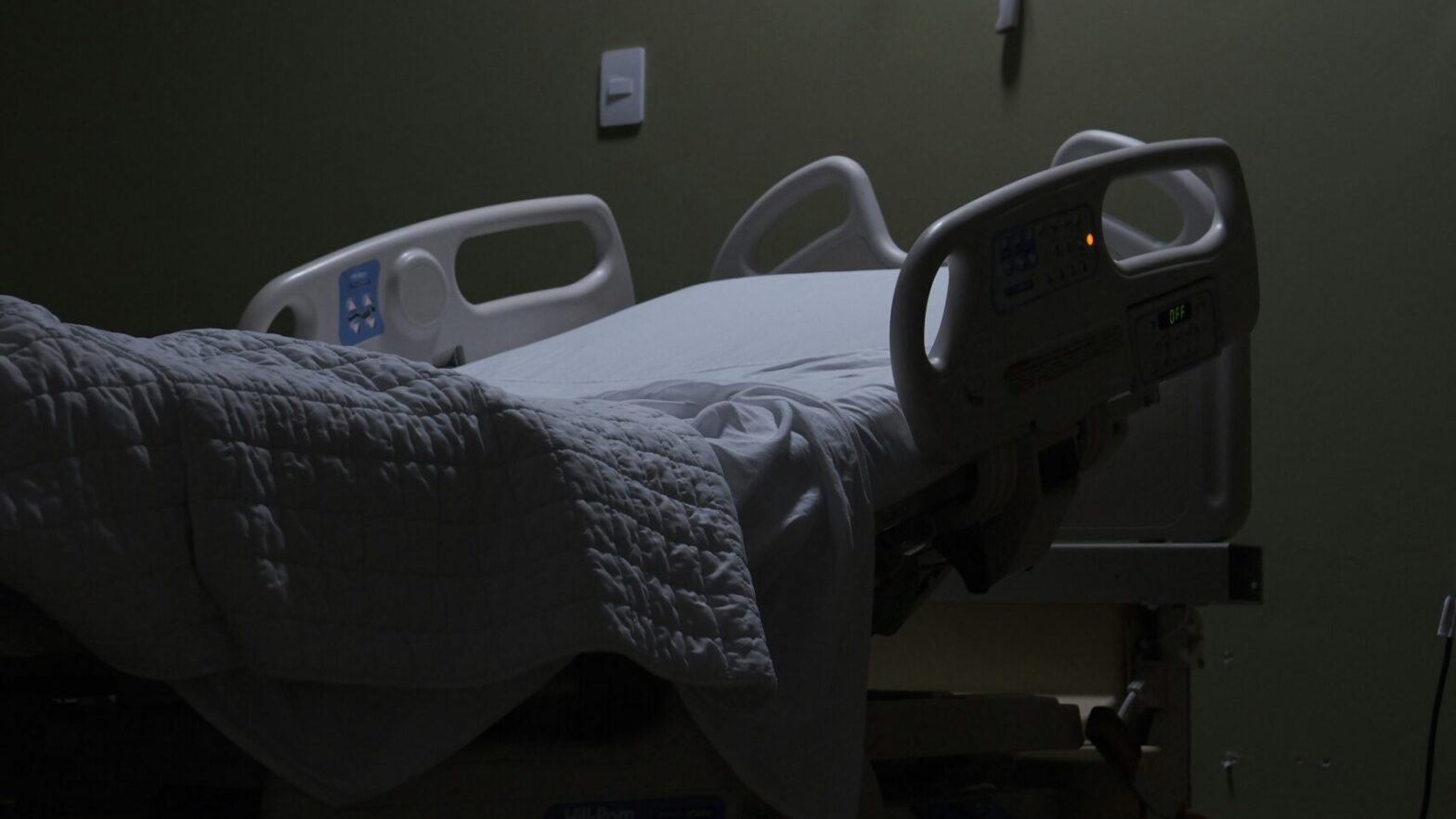 An image of an empty hospital bed. Health care workers represented by CUPE’s Ontario Council of Hospital Unions (OCHU-CUPE) held a rally outside local Ontario PC MPP David Piccini’s office this week in response to healthcare funding cuts.