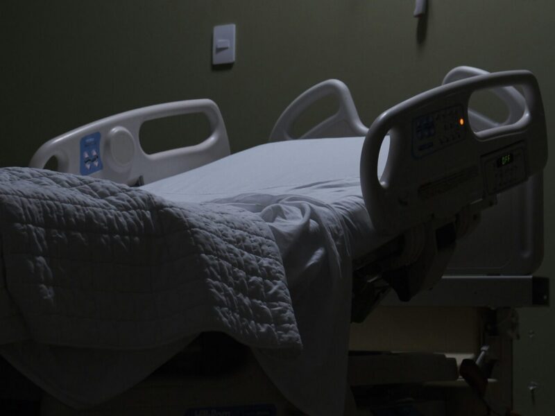 An image of an empty hospital bed. Health care workers represented by CUPE’s Ontario Council of Hospital Unions (OCHU-CUPE) held a rally outside local Ontario PC MPP David Piccini’s office this week in response to healthcare funding cuts.