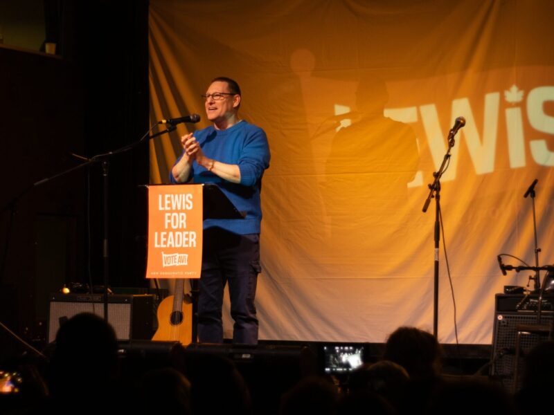 Avi Lewis speaking at an event.