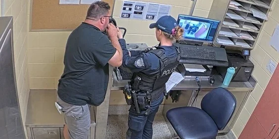 Ottawa City Councillor Matthew Luloff undergoing a breathalyzer test.