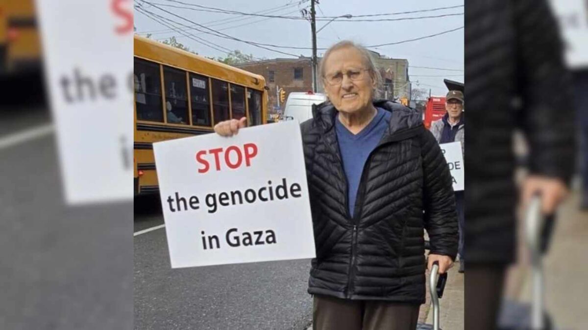Stephen Lewis at 87 holding a placard and demonstrating against the genocide in Gaza.