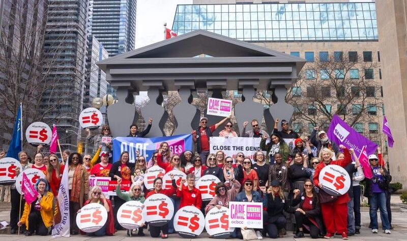 An image of members of Unifor and the Equal Pay Coalition rallying for pay equity.