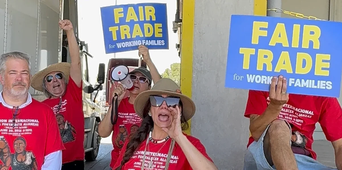 Protesters in El Paso, TX carrying a pro-fair trade message.