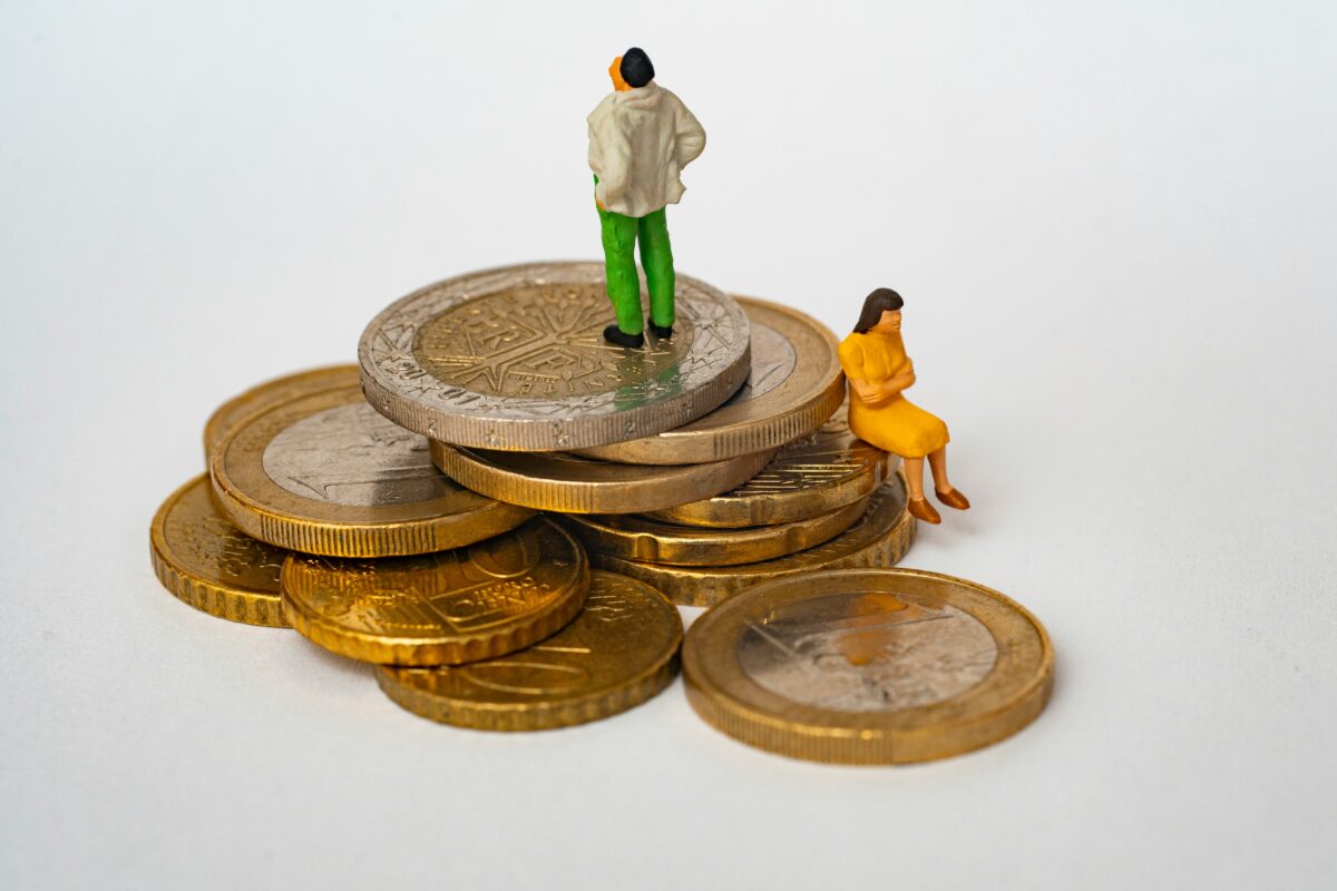 An image of two figurines sitting atop a pile of coins. Divorce ranks among the most stressful legal processes anyone faces, financially and emotionally. Your choice of lawyer will shape nearly every outcome.