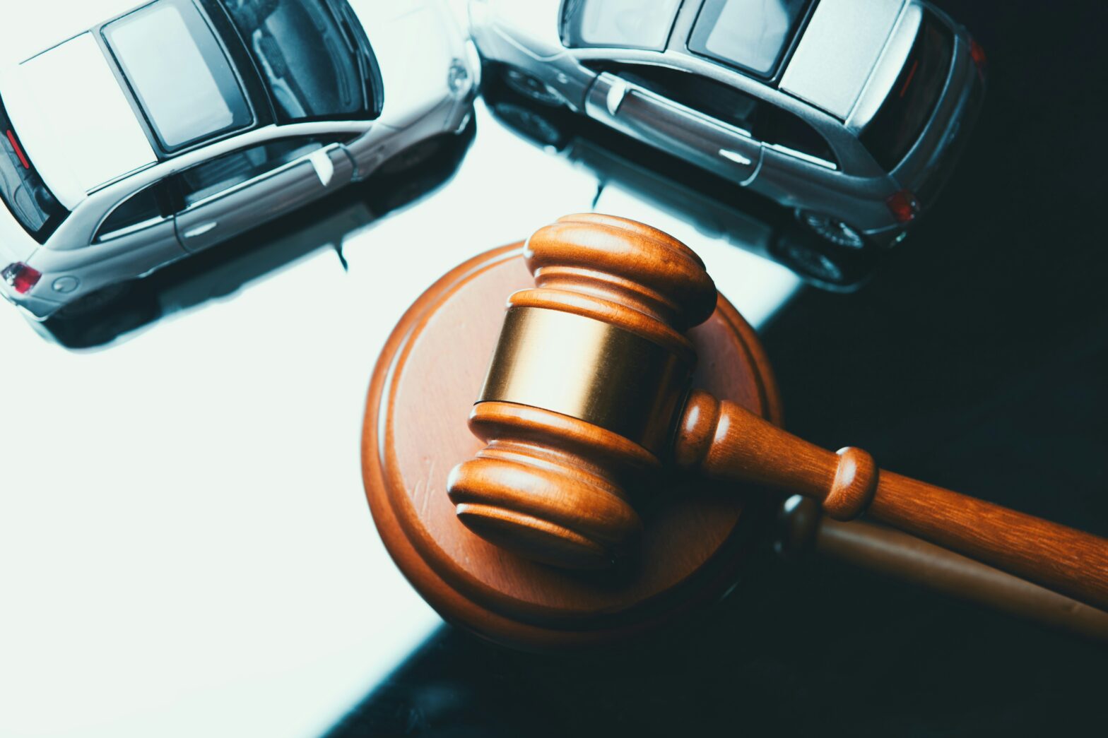 An image of a gavel and two cars edited above it. Bergel law is sharing advice to file a personal injury claim in Ontario.