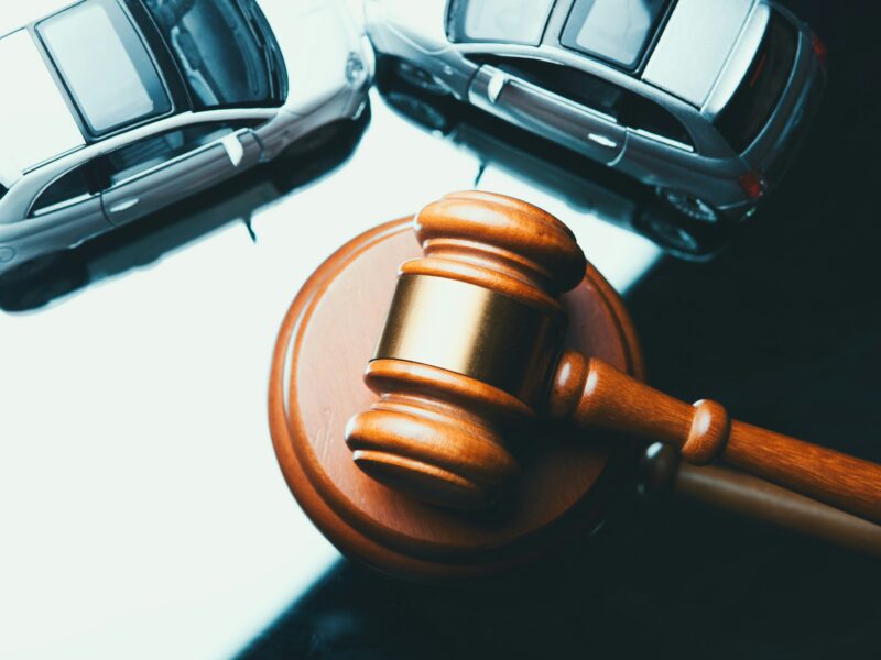 An image of a gavel and two cars edited above it. Bergel law is sharing advice to file a personal injury claim in Ontario.