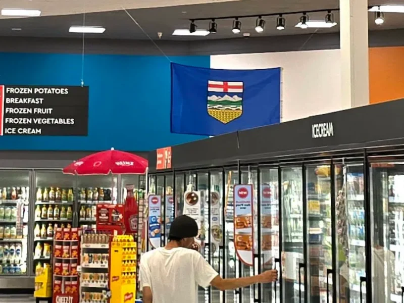 An Alberta flag hangs over the ice cream freezer at a Medicine Hat Safeway.