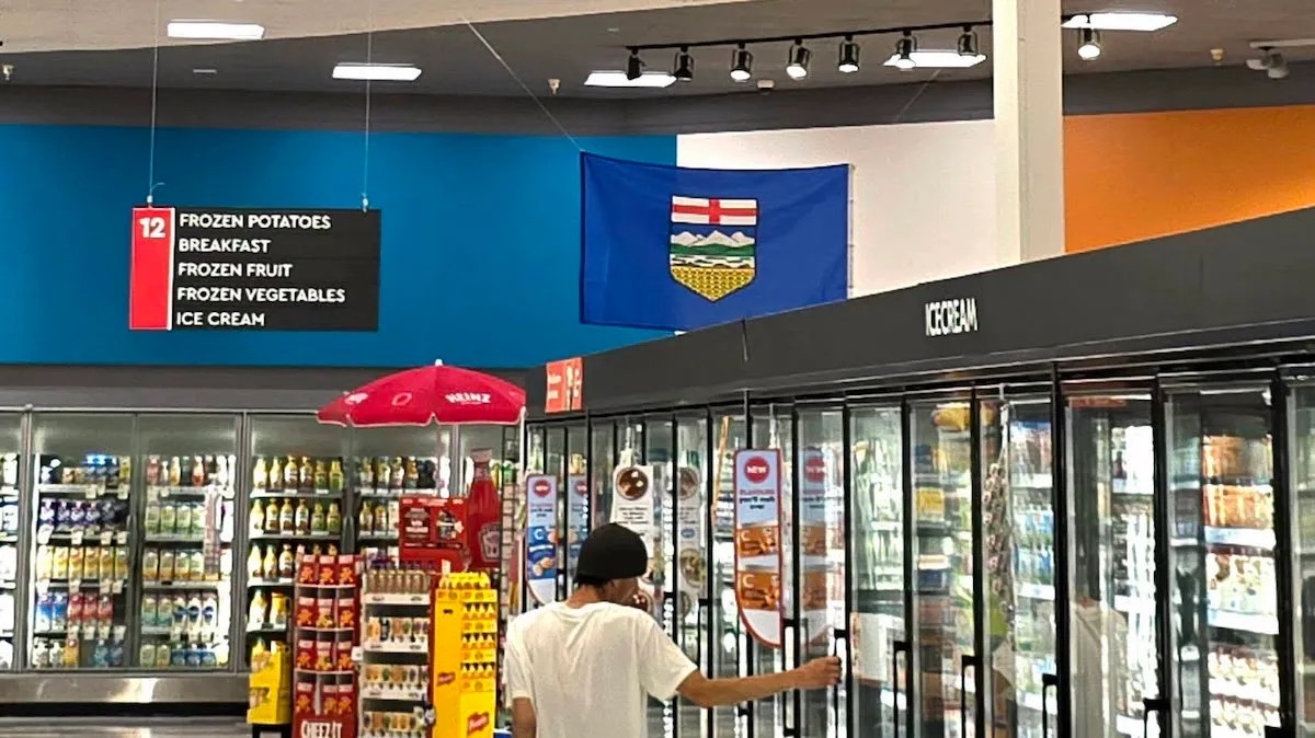 An Alberta flag hangs over the ice cream freezer at a Medicine Hat Safeway.