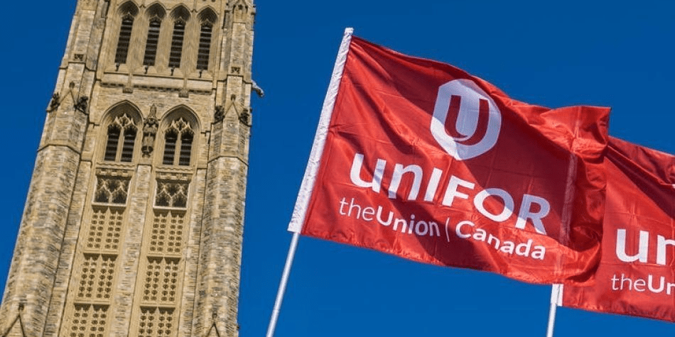 The Unifor flag flying in front of Parliament Hill.