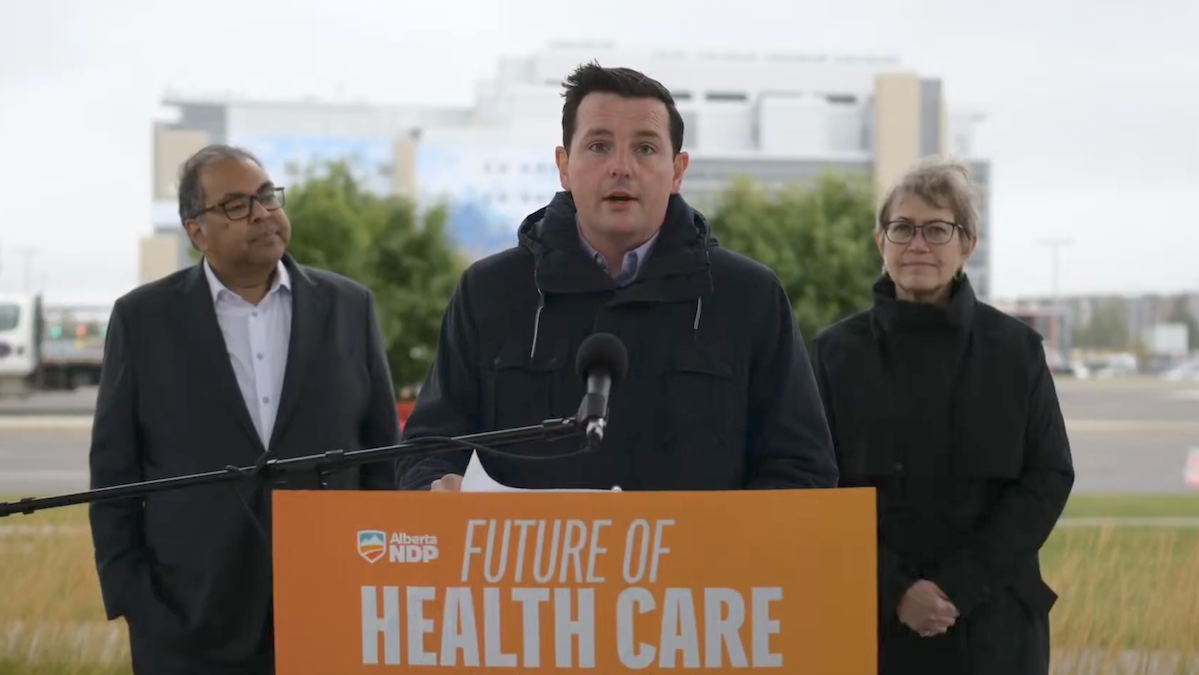 The NDP candidate in the Calgary-Shaw by-election, Kyle Campbell, is flanked by Party Leader Naheed Nenshi and Calgary Varsity MLA Luanne Metz, a physician, at a recent news conference on health care policy.